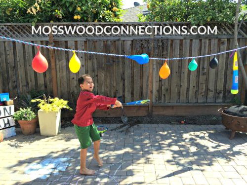 Pendulum Water Blast: a Visual Tracking Activity #mosswoodconnections #visiongames #visualtracking #grossmotor #sensory